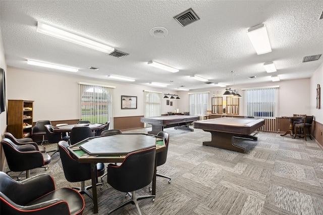 rec room featuring light colored carpet, a textured ceiling, and pool table