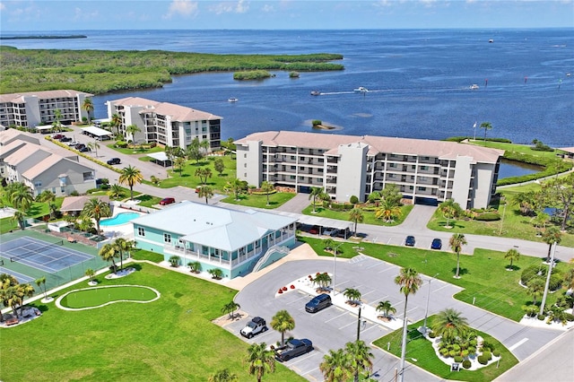 birds eye view of property featuring a water view