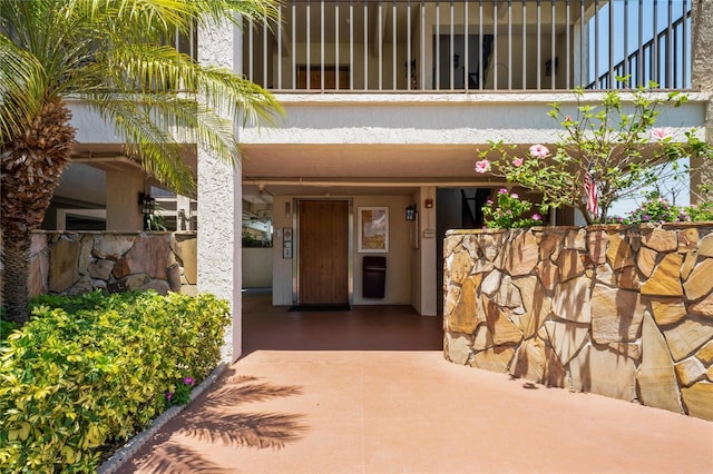 doorway to property with a balcony