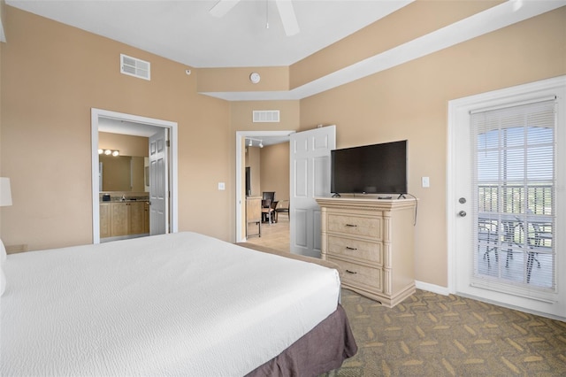 carpeted bedroom featuring connected bathroom, access to outside, and ceiling fan