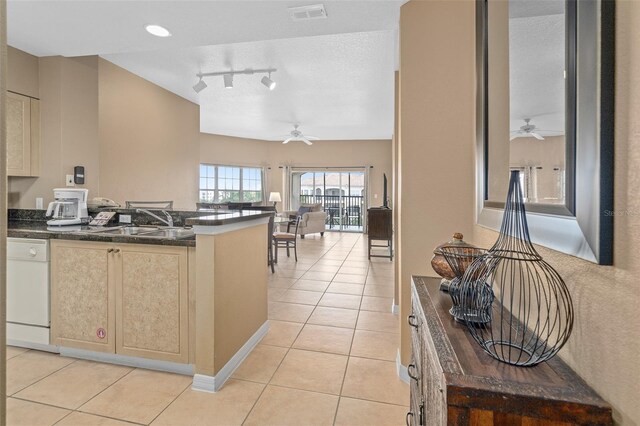 kitchen with ceiling fan, light tile patterned flooring, and white dishwasher