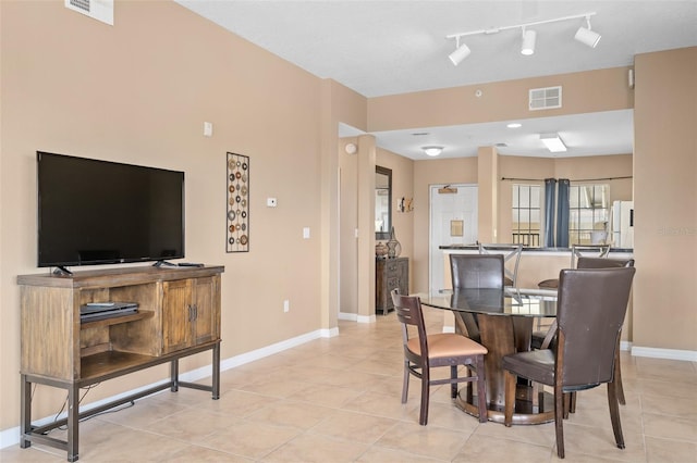 dining area with light tile patterned floors