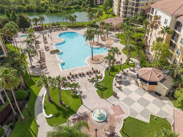 view of swimming pool with a water view