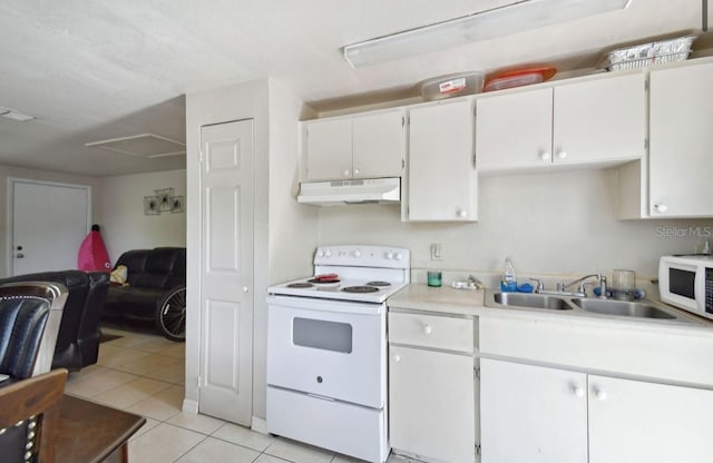 kitchen featuring white cabinetry, sink, light tile patterned floors, and white appliances