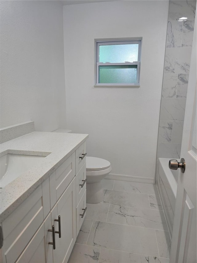 full bath with baseboards, marble finish floor, vanity, and toilet