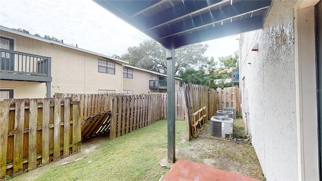 view of yard with central AC unit