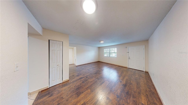 empty room featuring dark hardwood / wood-style floors