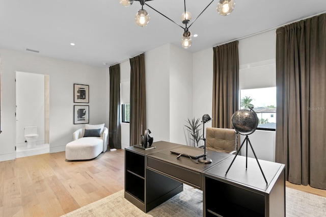 office area with light hardwood / wood-style flooring