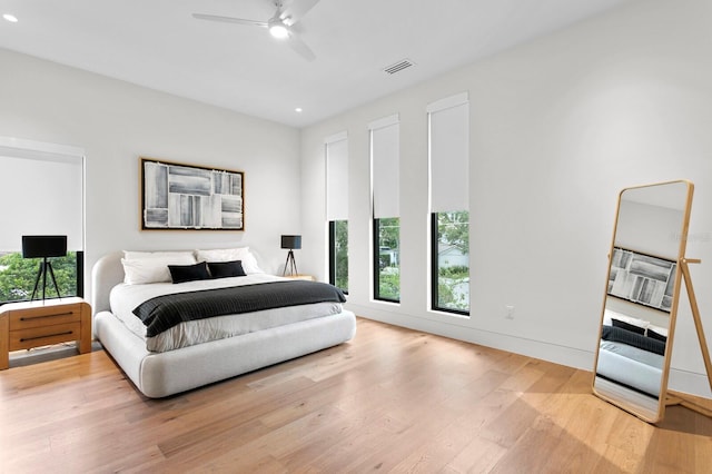 bedroom featuring ceiling fan and light hardwood / wood-style flooring