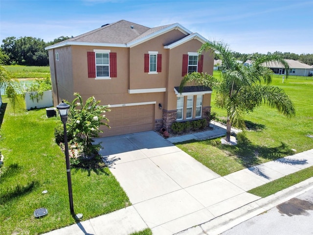 view of front facade featuring a front lawn and a garage