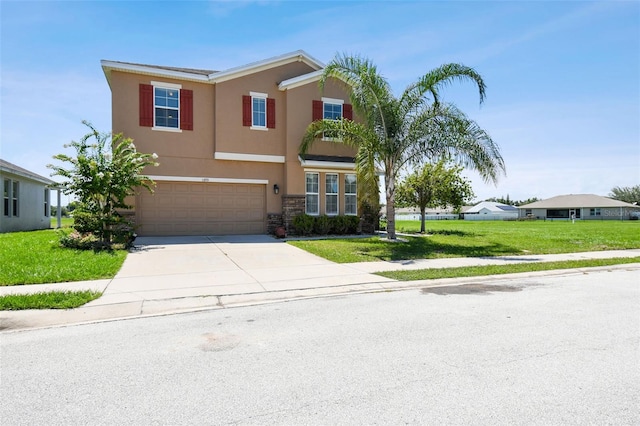 view of front of property with a front yard and a garage