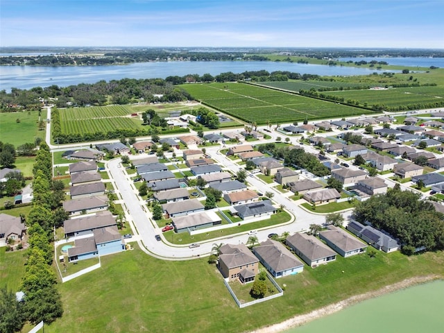 aerial view with a rural view and a water view