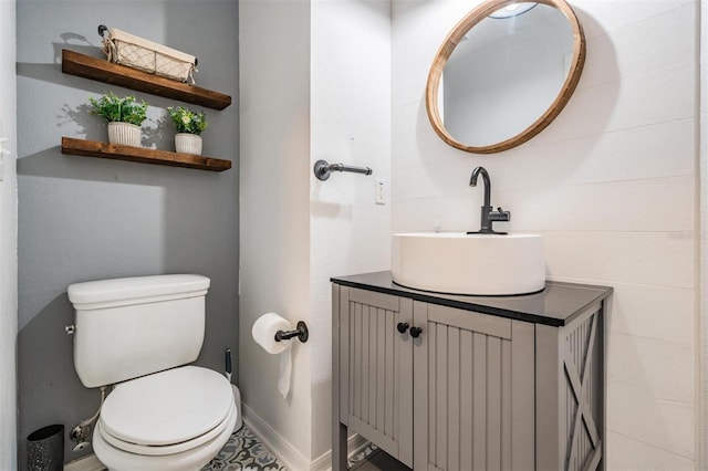 bathroom with tile patterned floors, toilet, and vanity