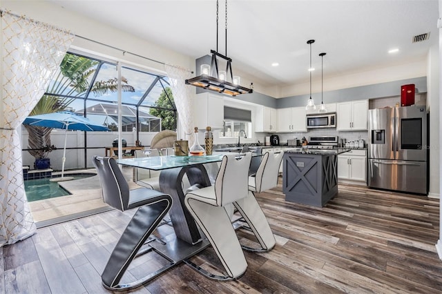 dining area featuring dark hardwood / wood-style floors