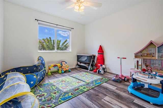 playroom featuring wood-type flooring and ceiling fan