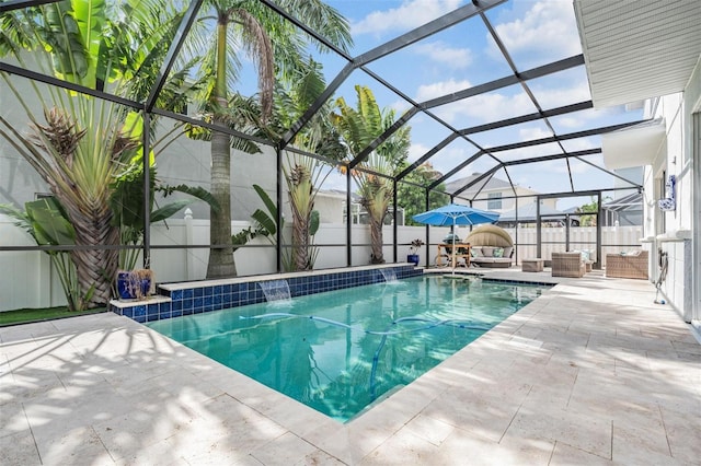 view of swimming pool featuring a patio, pool water feature, and glass enclosure