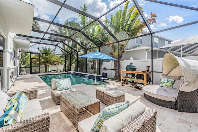 view of pool with a lanai, pool water feature, a patio, and an outdoor hangout area