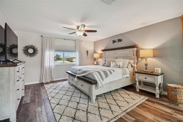 bedroom with ceiling fan and hardwood / wood-style floors