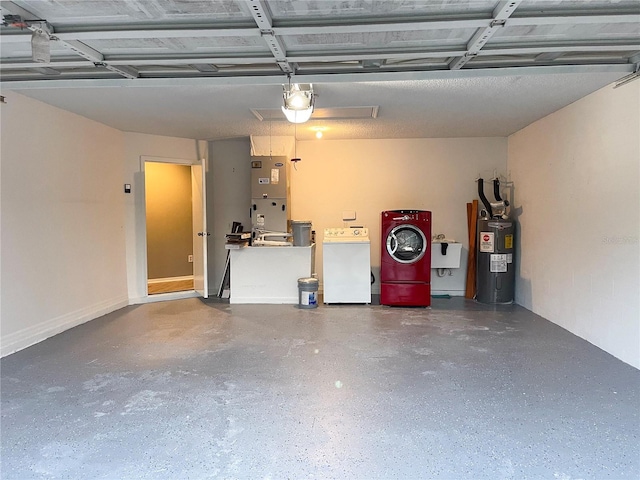 garage featuring electric water heater, heating unit, separate washer and dryer, and sink