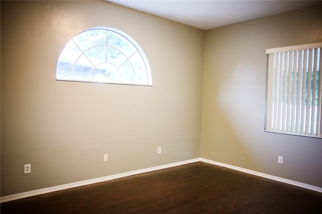 empty room with wood-type flooring