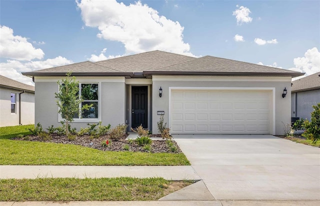 view of front facade featuring a garage and a front yard