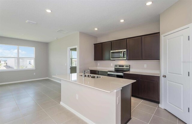 8322 SW 52nd Lane Rd, Ocala, FL 34481 - kitchen featuring light tile patterned flooring, appliances with stainless steel finishes, a sink, and recessed lighting