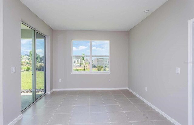 8322 SW 52nd Lane Rd, Ocala, FL 34481 - empty room with light tile patterned floors and baseboards
