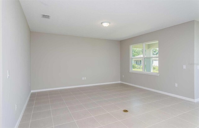 8322 SW 52nd Lane Rd, Ocala, FL 34481 - unfurnished room featuring visible vents, baseboards, and light tile patterned floors