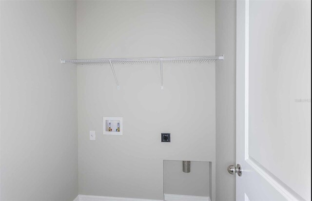 8322 SW 52nd Lane Rd, Ocala, FL 34481 - washroom with laundry area, electric dryer hookup, and hookup for a washing machine