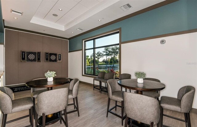8322 SW 52nd Lane Rd, Ocala, FL 34481 - dining area featuring a raised ceiling, baseboards, light wood-type flooring, and visible vents