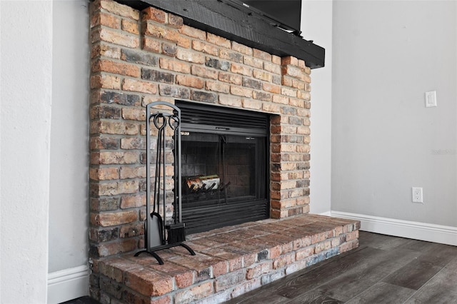 details with wood-type flooring and a fireplace