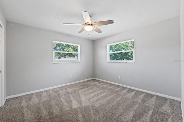 carpeted empty room with ceiling fan