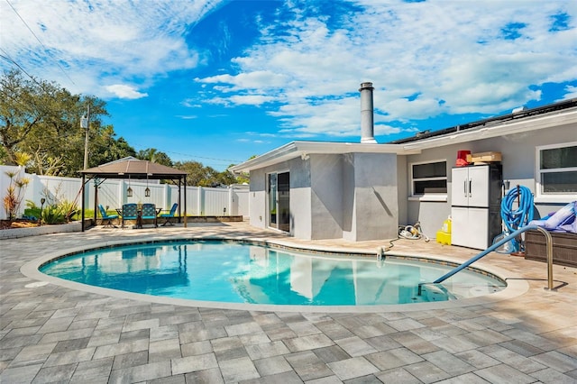 view of pool featuring a gazebo and a patio area