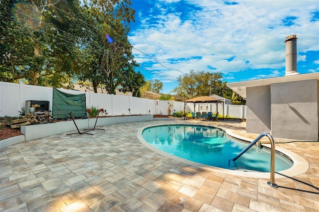 view of swimming pool with a gazebo and a patio area