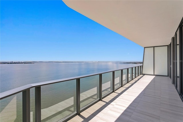 balcony featuring a water view