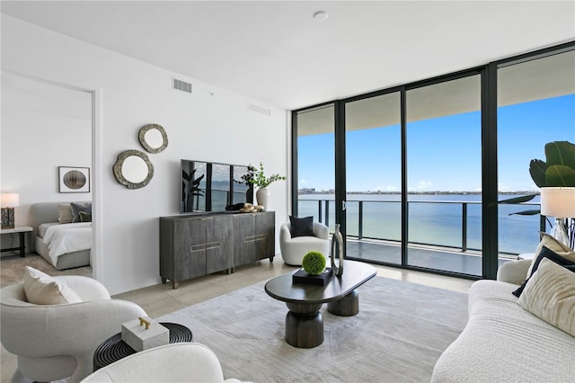 living room featuring floor to ceiling windows