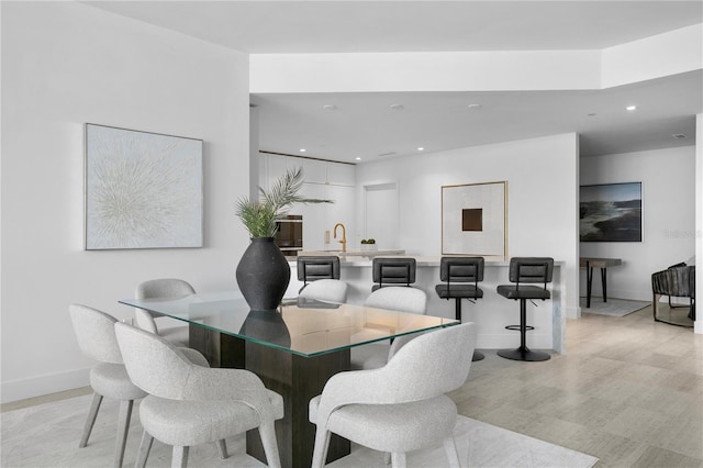 dining area featuring sink