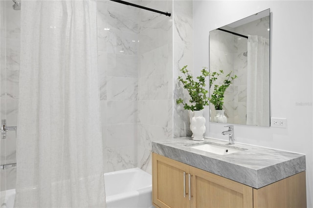 bathroom featuring vanity and shower / tub combo with curtain