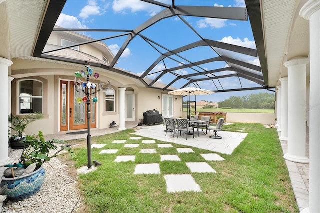 view of yard with a lanai and a patio