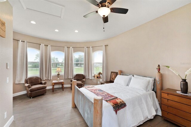 bedroom featuring hardwood / wood-style flooring and ceiling fan