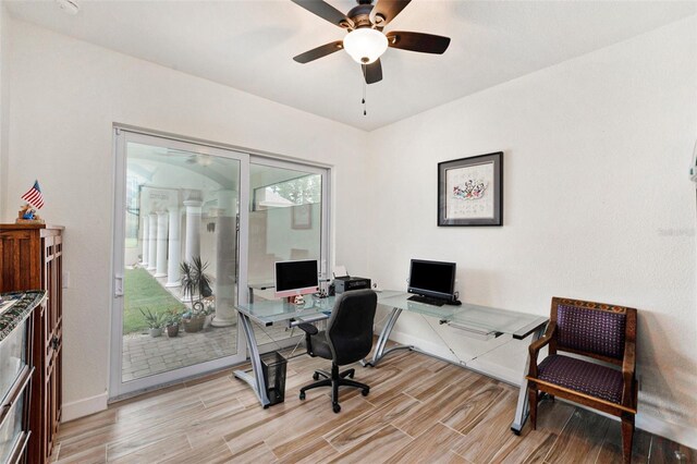 office space featuring ceiling fan and light wood-type flooring