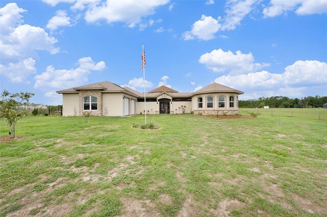 back of house with a yard