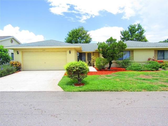 ranch-style home with a front lawn and a garage