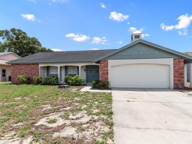 ranch-style home with a front yard and a garage