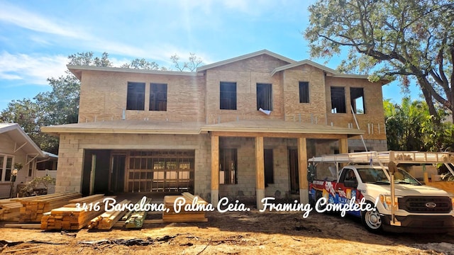 view of front of home with a garage and covered porch