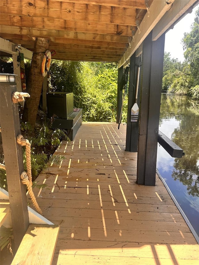 wooden terrace with a water view