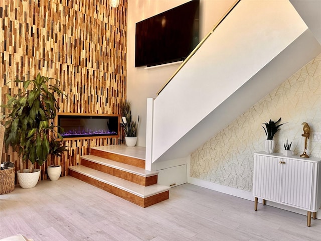 staircase featuring hardwood / wood-style floors