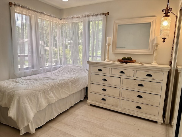 bedroom with light hardwood / wood-style floors