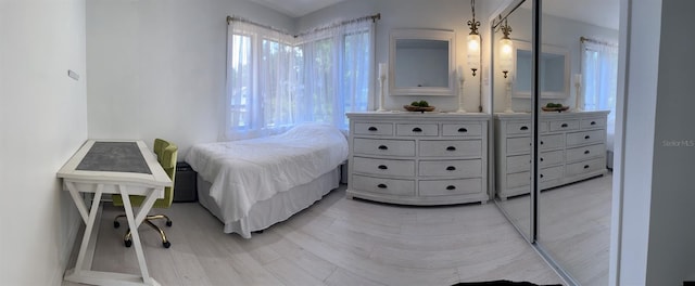 bedroom with light wood-type flooring