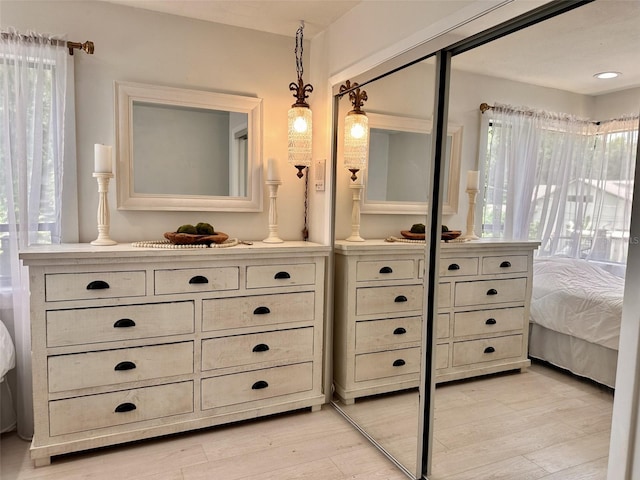 bathroom with plenty of natural light, hardwood / wood-style floors, and vanity